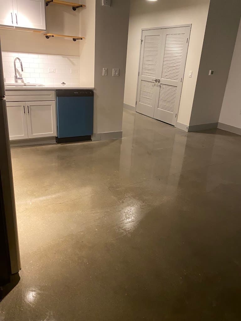 Empty room with a freshly cleaned, polished floor after a move-out clean